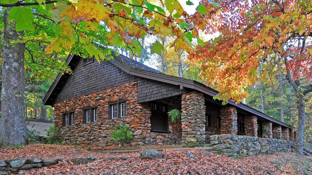 The Bathouse, a stone building with brown siding at Paris Mountain State Park, South Carolina.