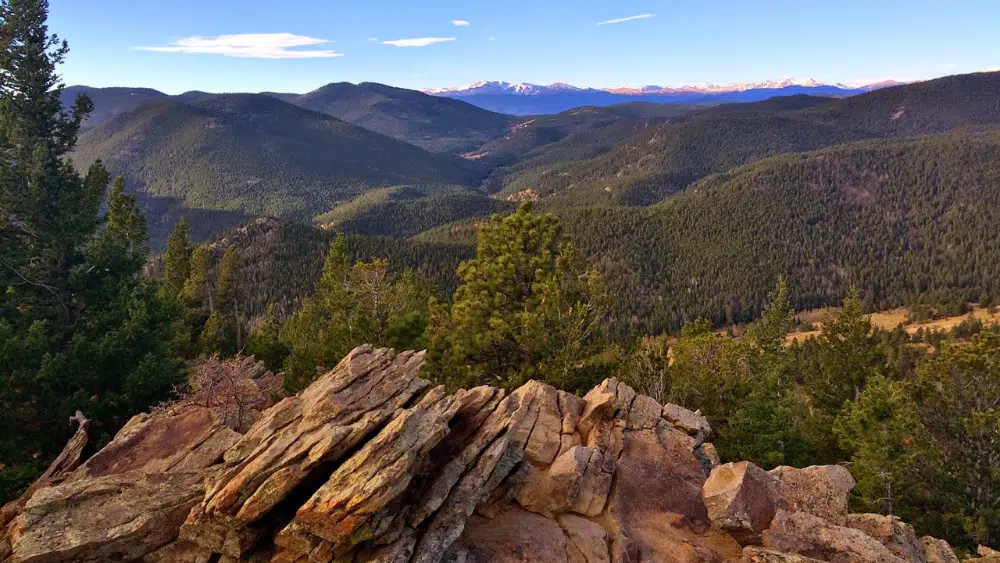 View from a cliff of green trees at Golden Gate Canyon State Park, Colorado.