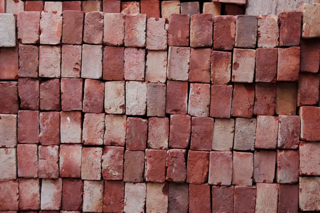 Pile of red bricks for construction clean up.
