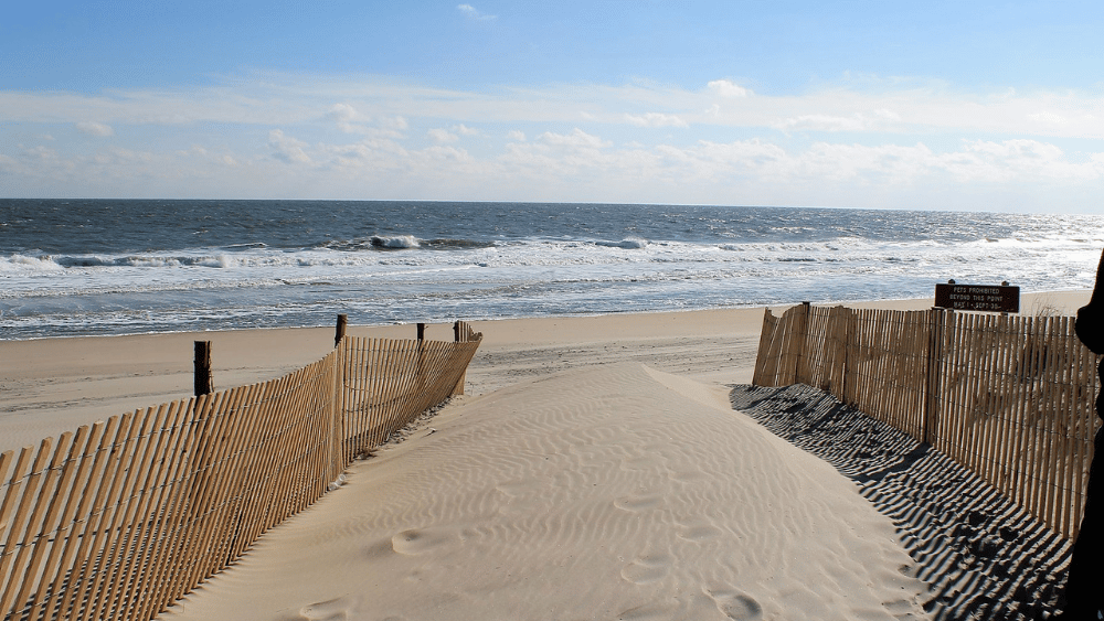 View of the beach, sand, and surf at Fenwick Island State Park, Delaware.