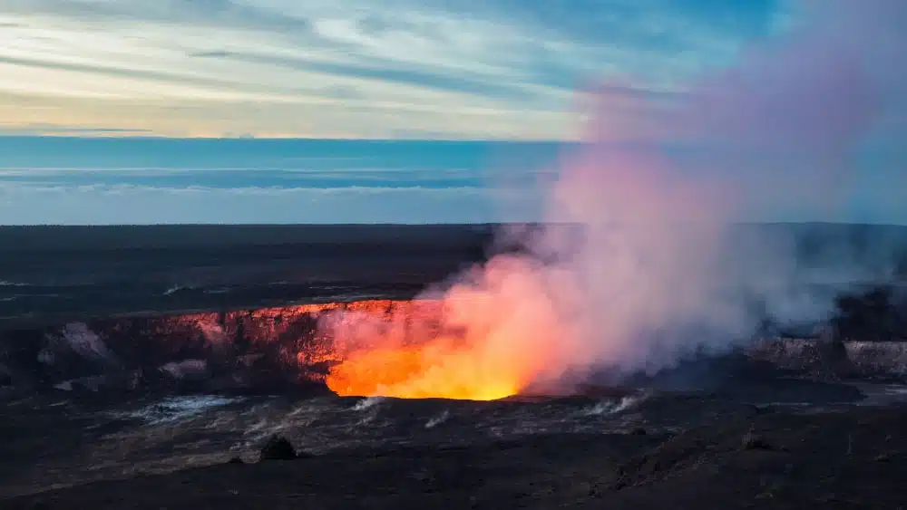 Fire and storm pour from active Kilauea Crater in Hawaii Volcanoes National Park on the Big Island