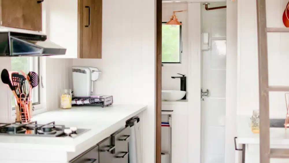 tiny home interior kitchen with white theme louisiana
