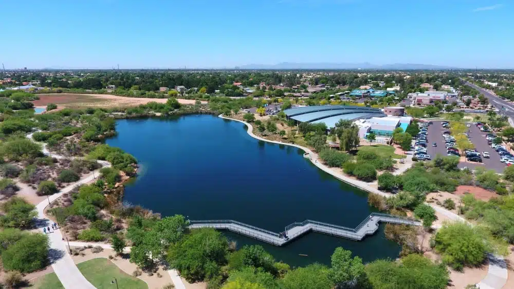 View of lake and trails by the Gilbert Public Library (on right) in Gilbert, Arizona