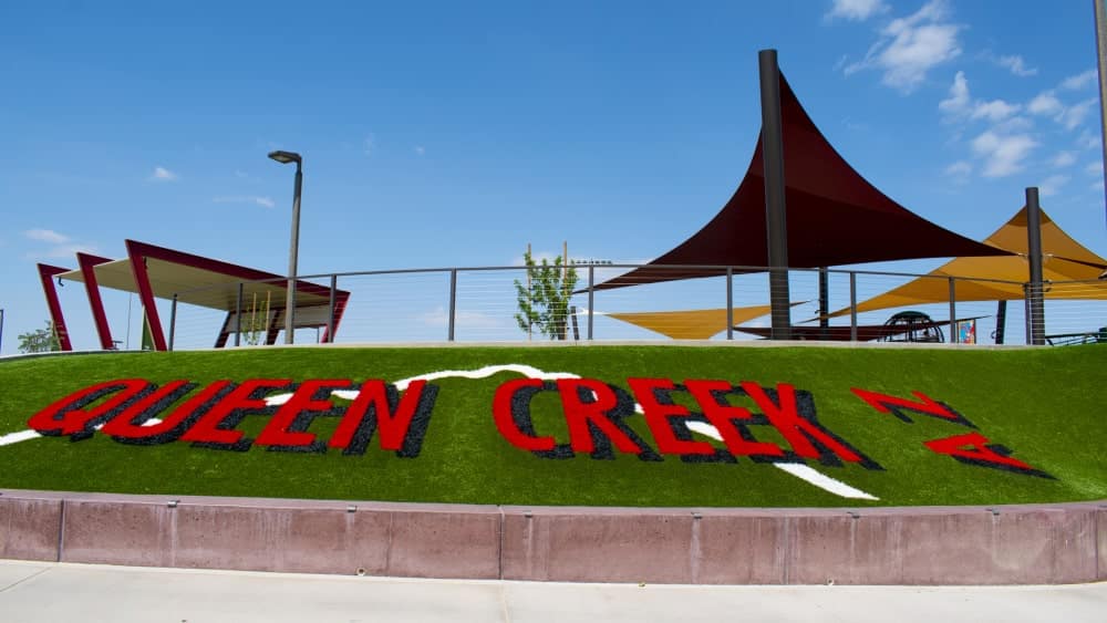 Image of words "Queen Creek AZ" in grass at park in Queen Creek, Arizona