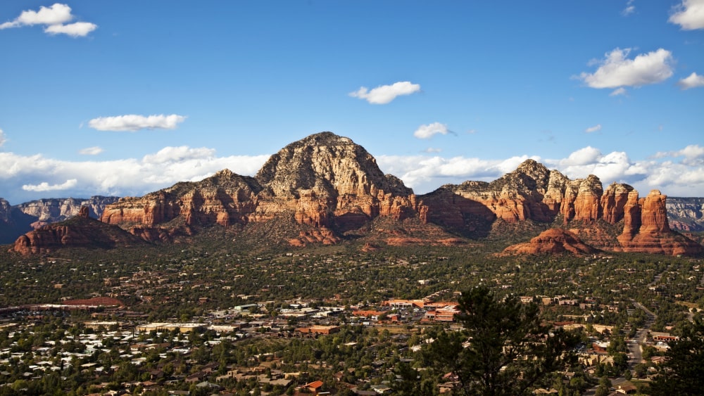 View of Sedona, Arizona, with red rock mountain formations in background