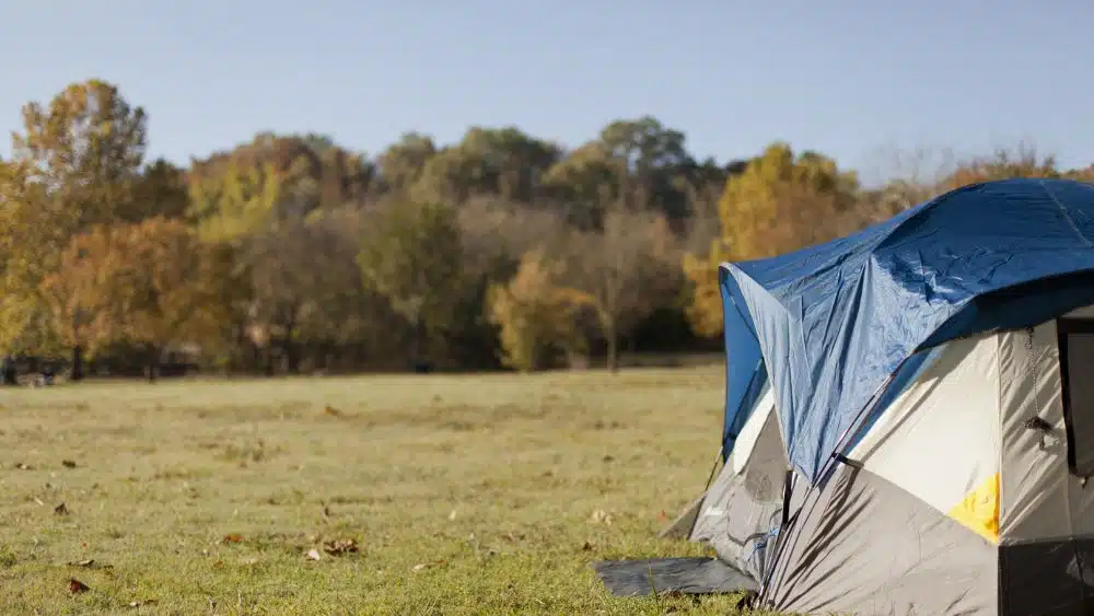 Camping tent pitched in a field.