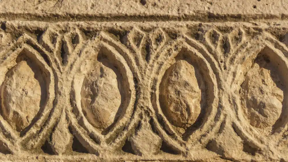 Inset, ornate designs carved directly into the drywall.