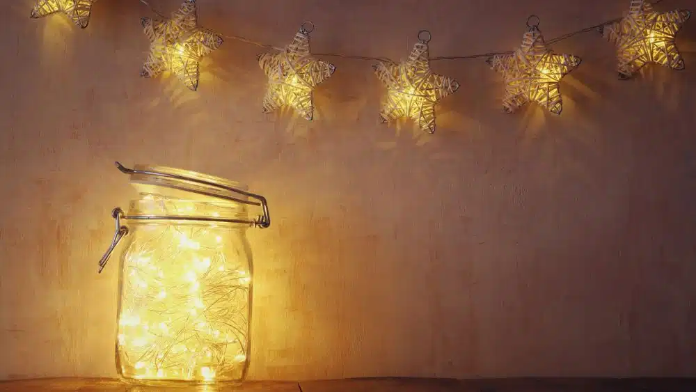 Twinkle lights in a hinged jar, and share lights hanging above it.