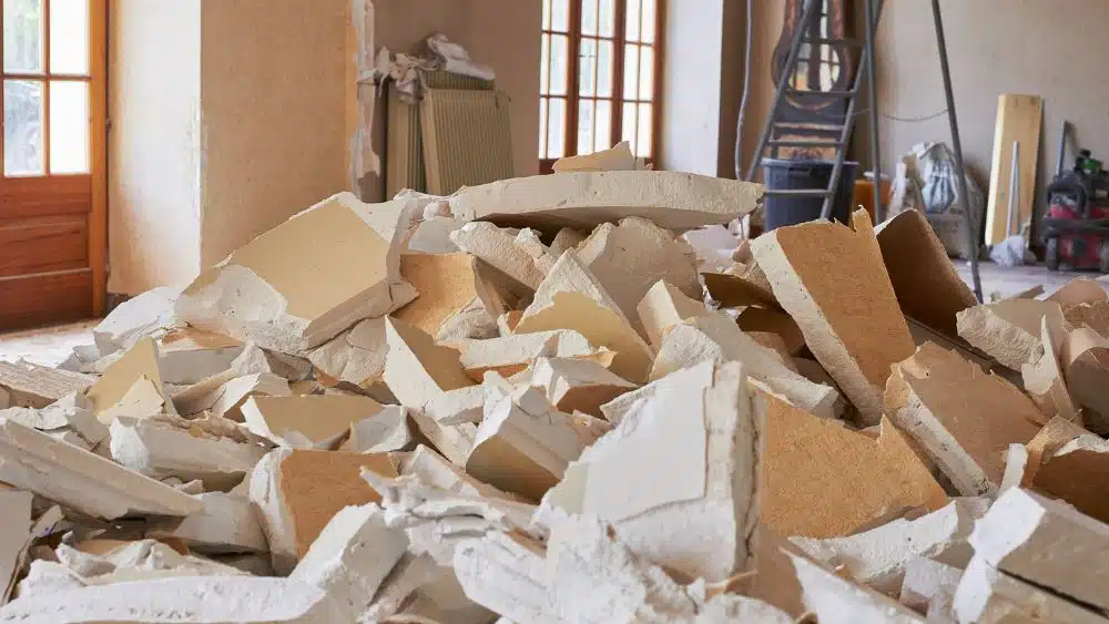 Pile of drywall in a home being demolished.